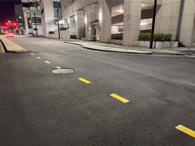 Fresh asphalt pavement on a Florida roadway with completed traffic markings