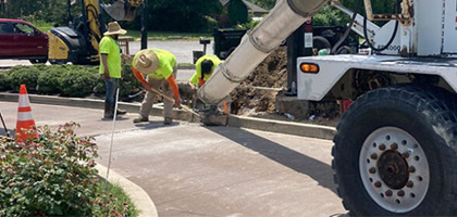 Photo of concrete curb being repaired