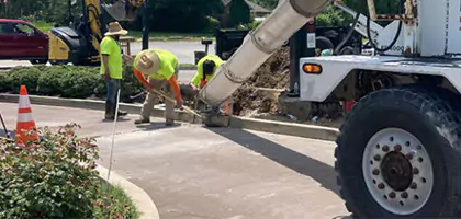 Photo of concrete curb being repaired